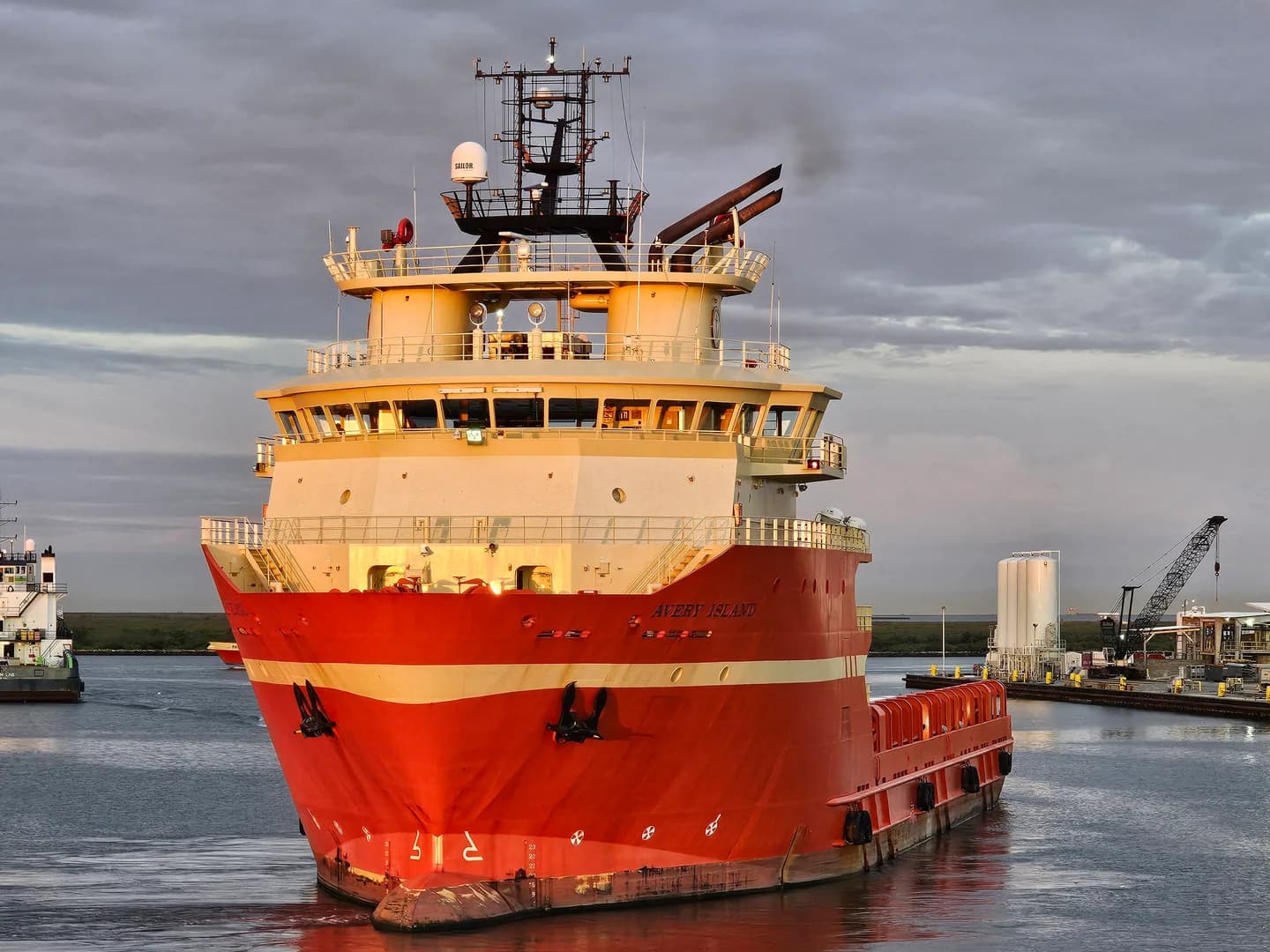 An offshore supply vessel under way in a coastal support base