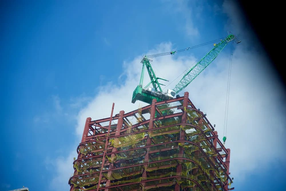 A bolted steel frame structure during construction, showing connections and bracing